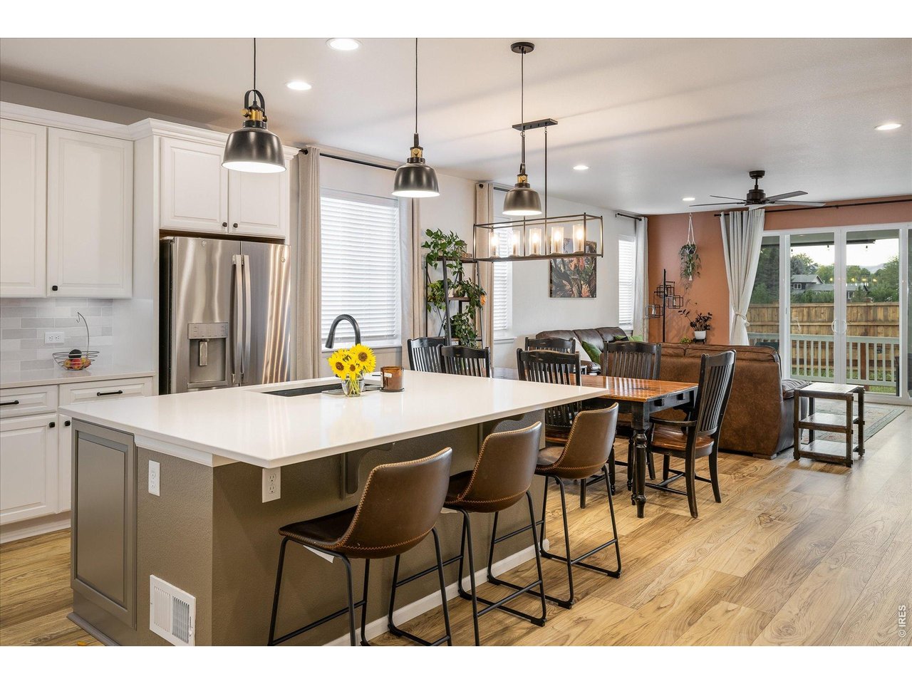 5311 Routt Court Arvada, CO 80002 - Photo 4 of 48 Seamless flow between kitchen, dining, and living