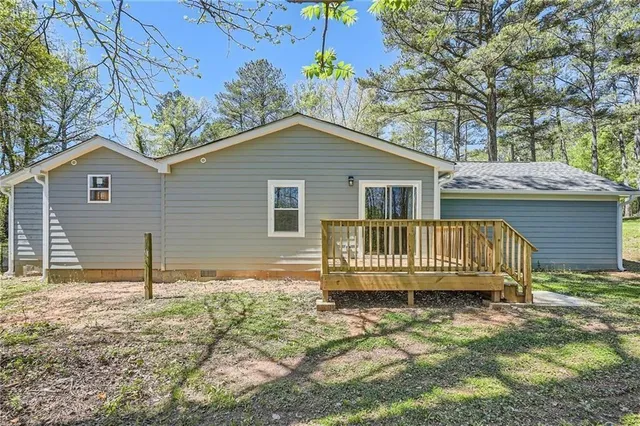 a backyard of a house with a deck