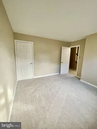 a view of an empty room and entryway