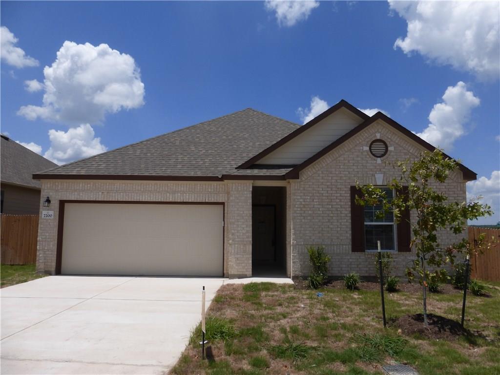 7200 Altidore Drive Austin, TX 78744 - Photo 1 of 23 a front view of a house with garden
