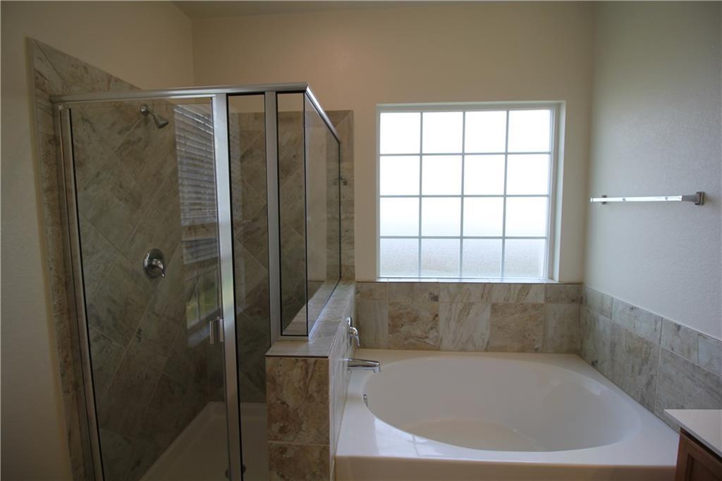 7200 Altidore Drive Austin, TX 78744 - Photo 15 of 23 a bathroom with a shower and window