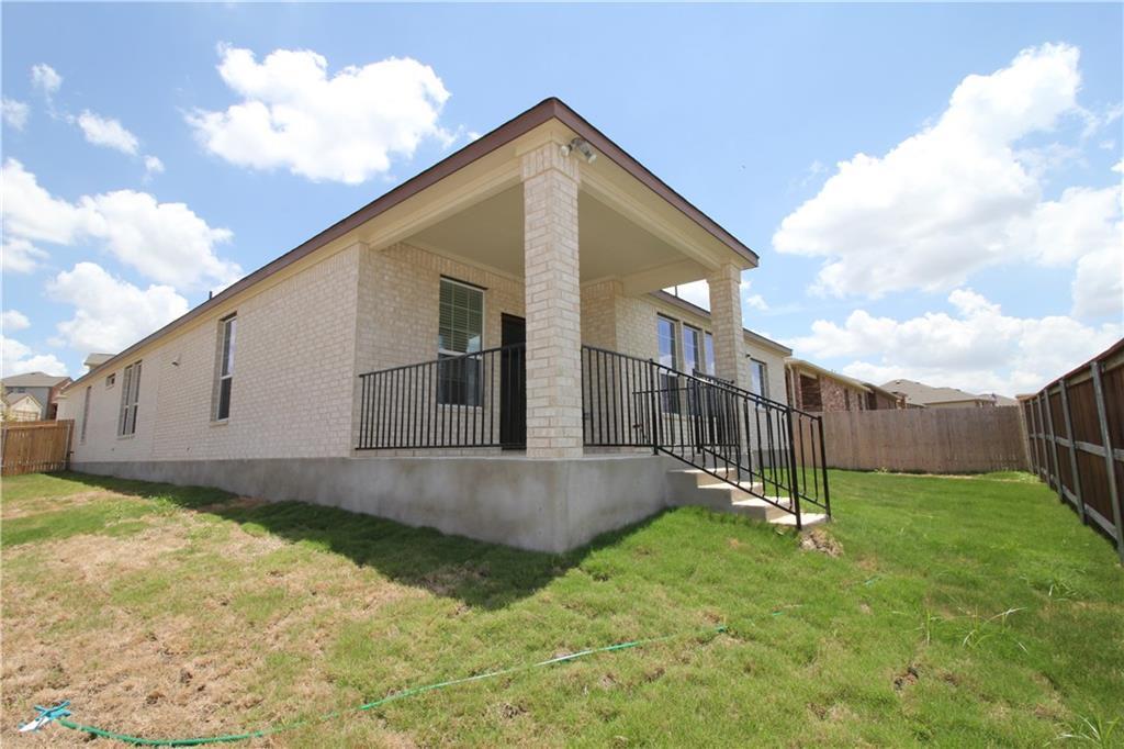 7200 Altidore Drive Austin, TX 78744 - Photo 21 of 23 a view of a house with a yard