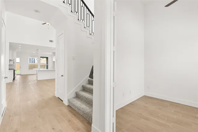 a view of an entryway with wooden floor