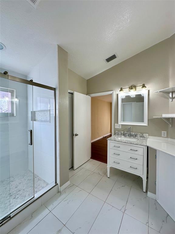 5541 Dark Star Loop Wesley Chapel, FL 33544 - Photo 12 of 14 a bathroom with a double vanity sink mirror and shower