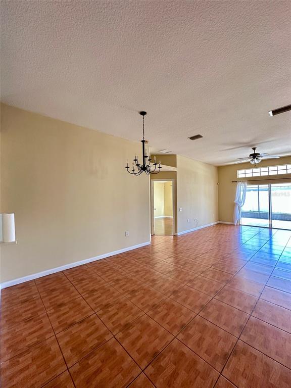 5541 Dark Star Loop Wesley Chapel, FL 33544 - Photo 2 of 14 a view of a room with window and wooden floor