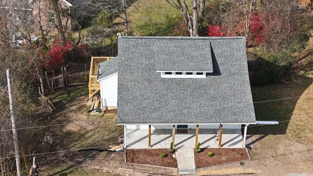 a aerial view of a house with yard and sitting area