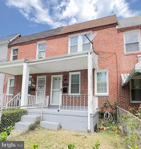 front view of a house with a small yard