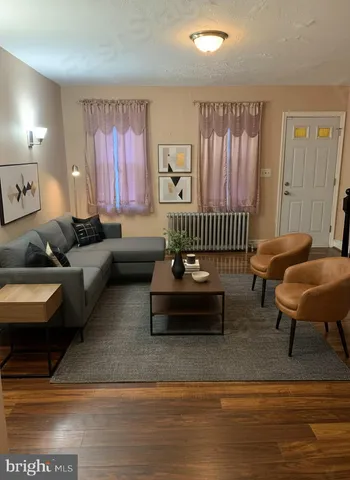 a living room with furniture and a rug