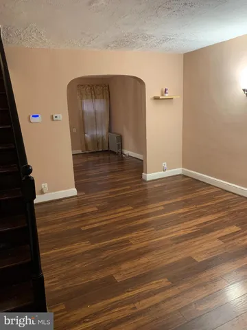 a view of a livingroom with wooden floor