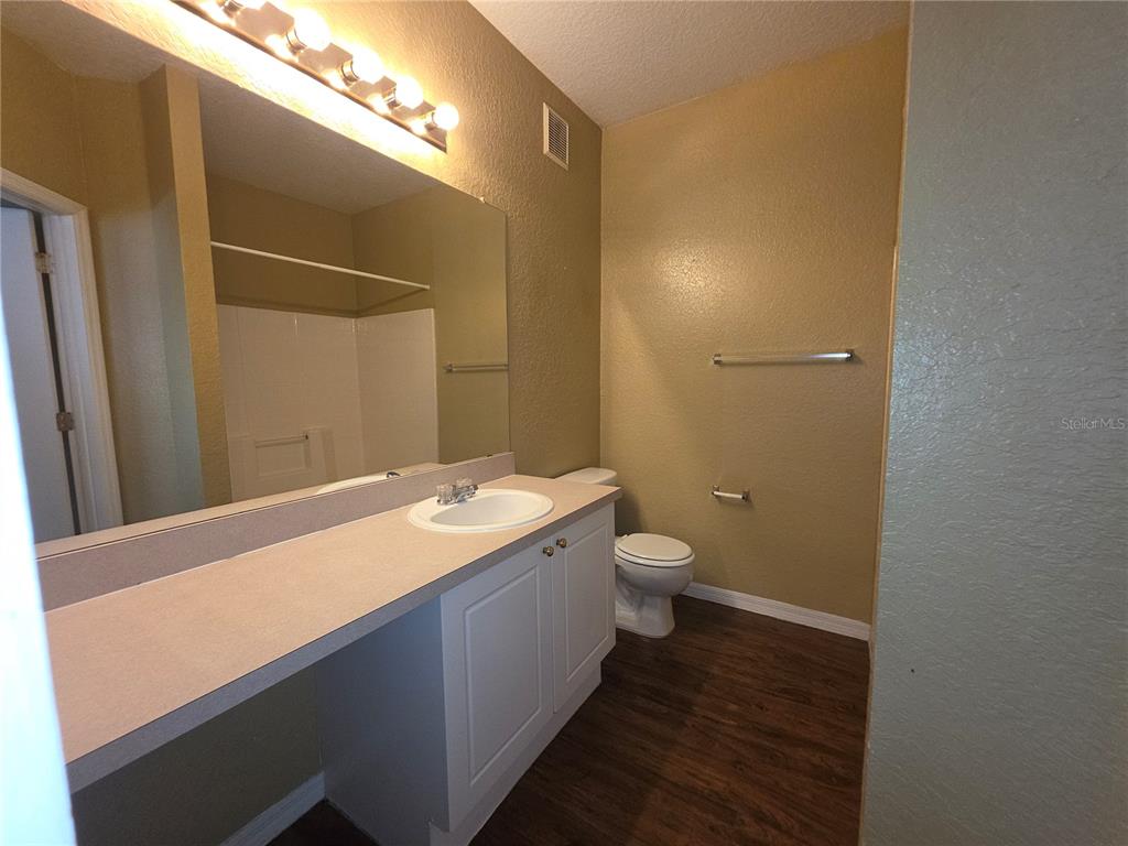 824 Grand Regency Pointe, Unit 101 Altamonte Springs, FL 32714 - Photo 12 of 14 a bathroom with a sink and a mirror