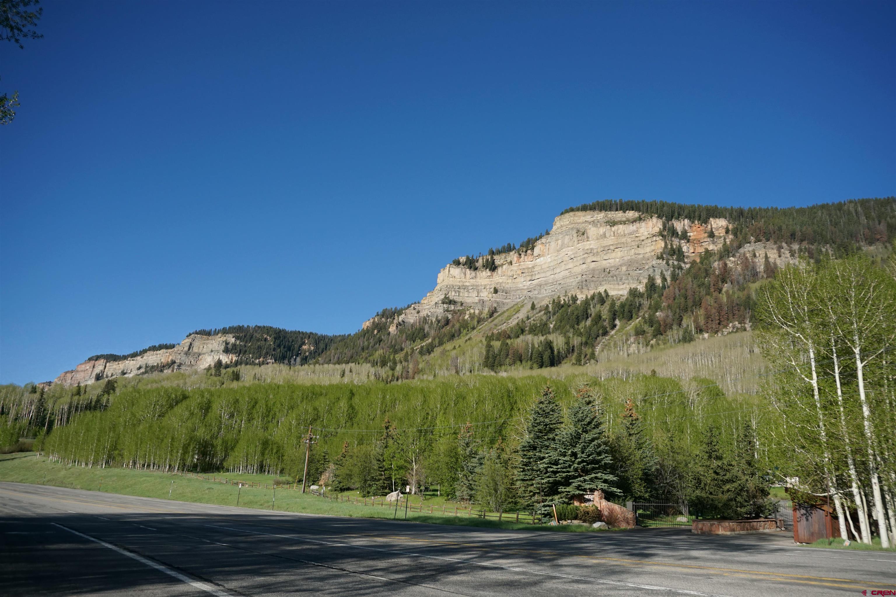 350 Falcon Ridge Road Durango, CO 81301 - Photo 24 of 39 a view of a large building with mountains in the background