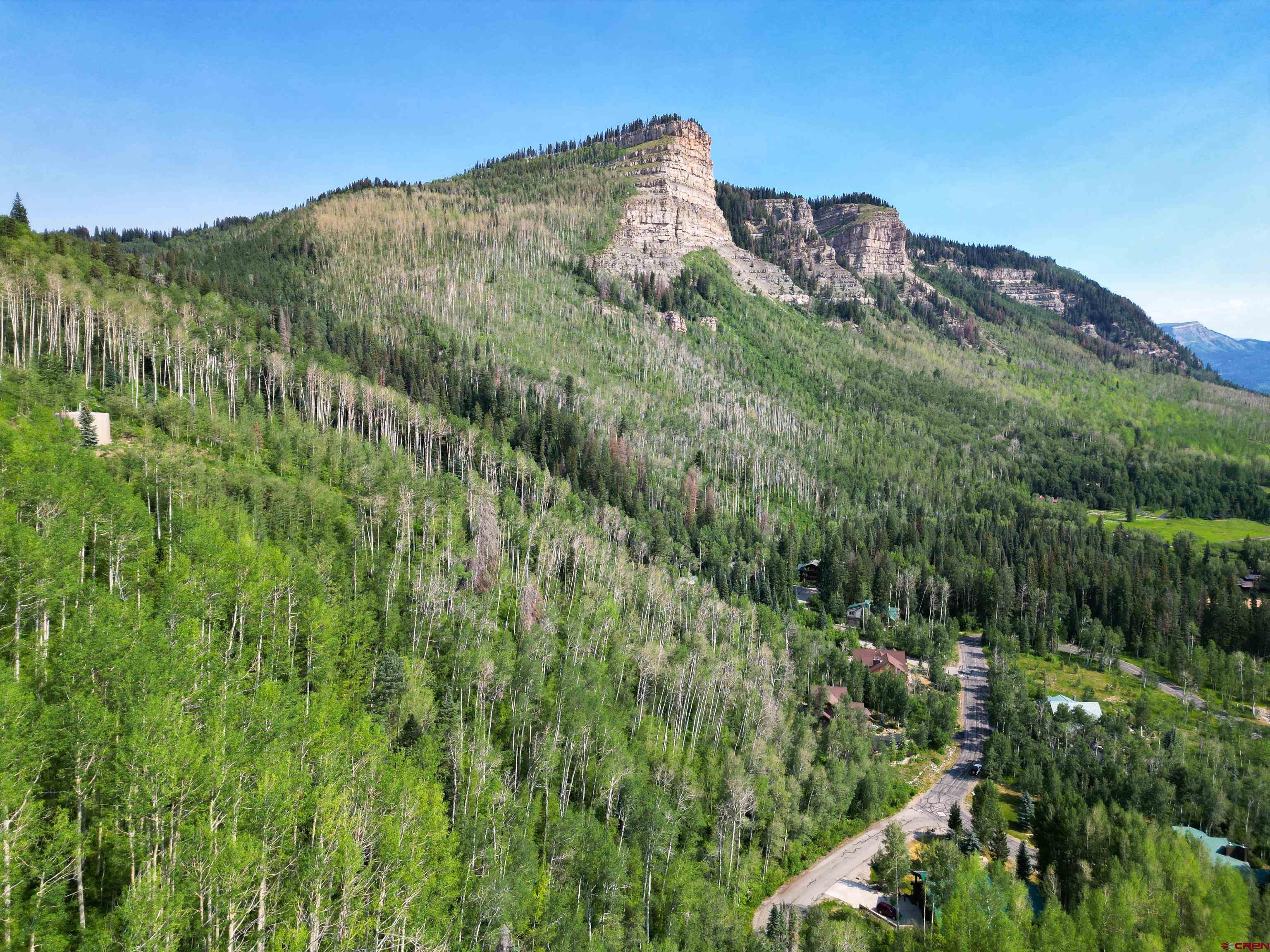 350 Falcon Ridge Road Durango, CO 81301 - Photo 29 of 39 a view of a large building with a mountain in the background