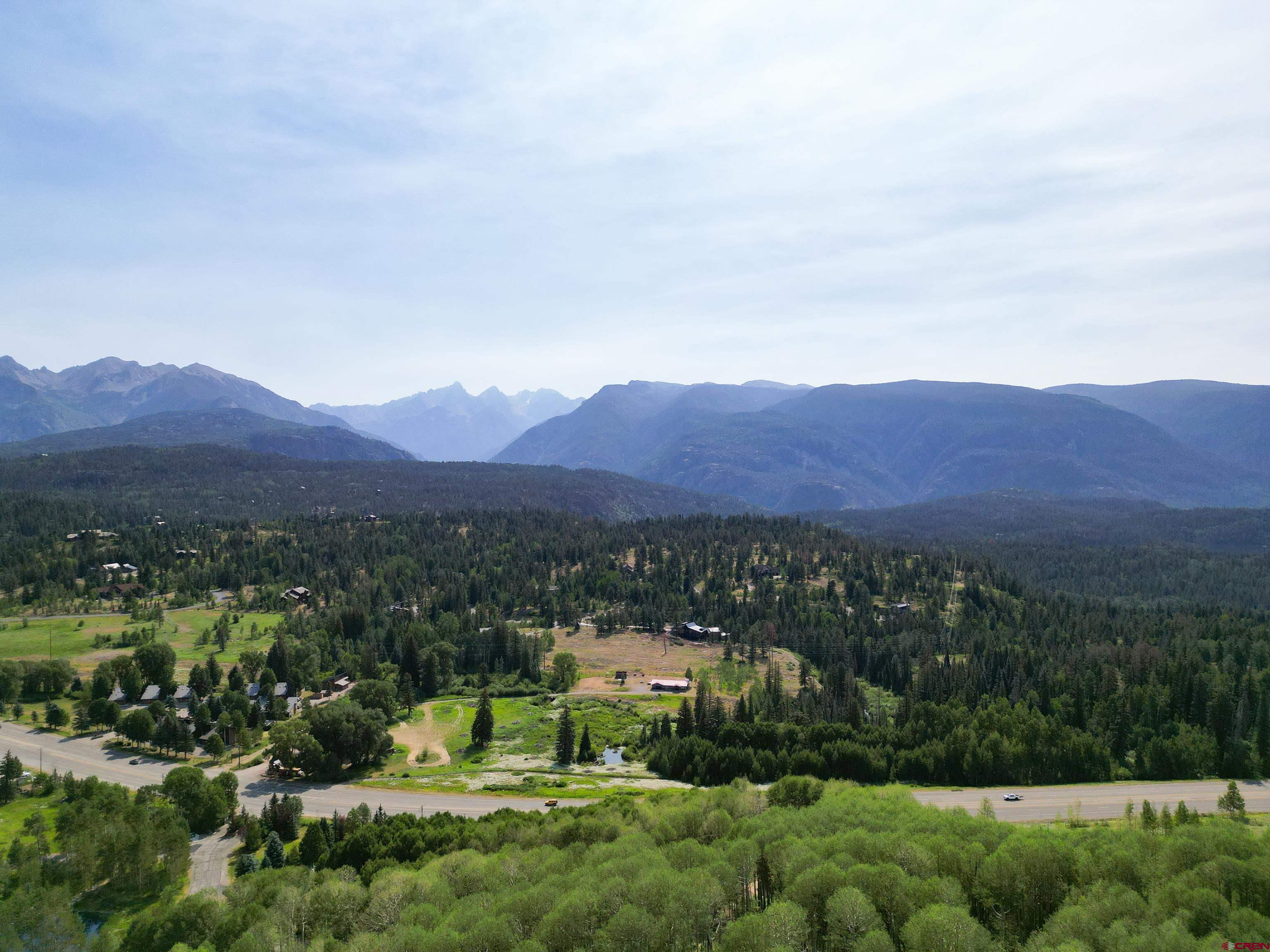 350 Falcon Ridge Road Durango, CO 81301 - Photo 30 of 39 a view of a lush green field with mountains in the background