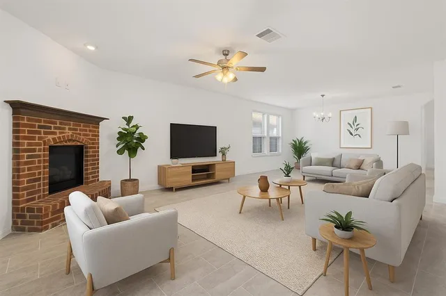 a living room with furniture and a flat screen tv