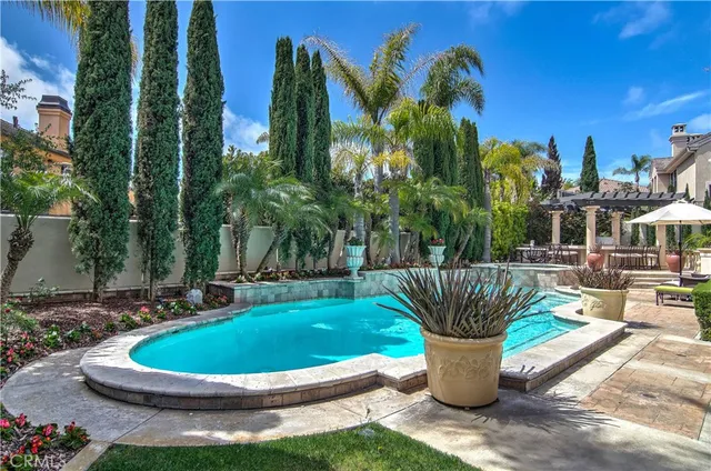 a view of a patio with swimming pool table and chairs