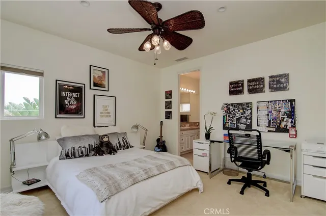 a living room with furniture a lamp and a window