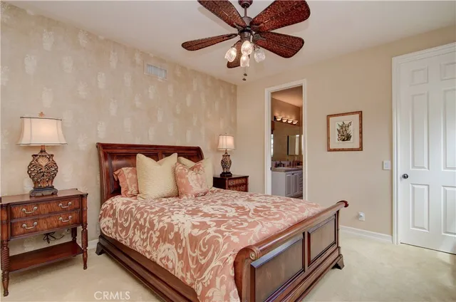 a living room with furniture a fireplace and a large window