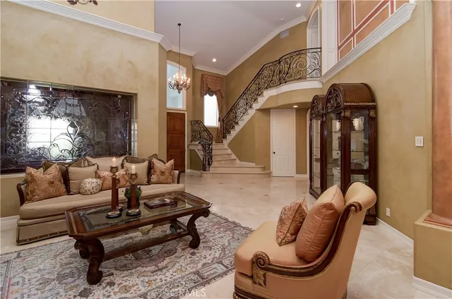 a kitchen with stainless steel appliances a stove and a bookshelf