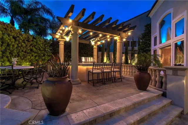 a view of a backyard with swimming pool