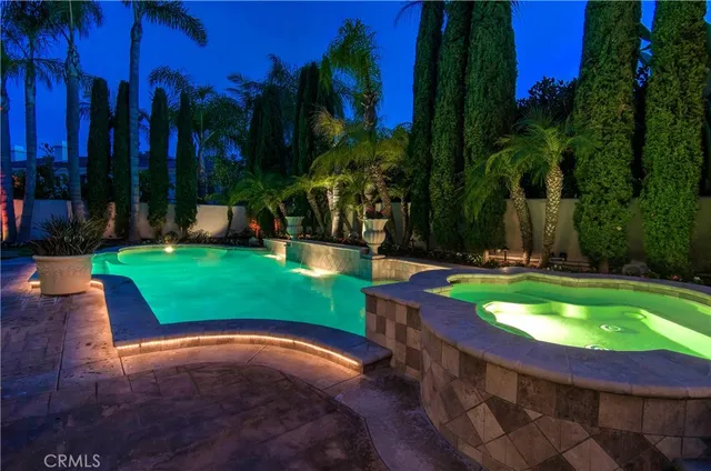 a view of a swimming pool with sitting area
