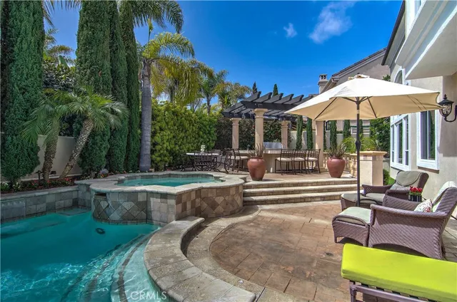 a view of a patio with couches chairs and potted plants