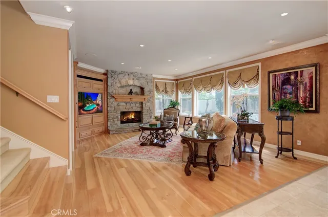 a spacious bedroom with a balcony a bed and a fireplace