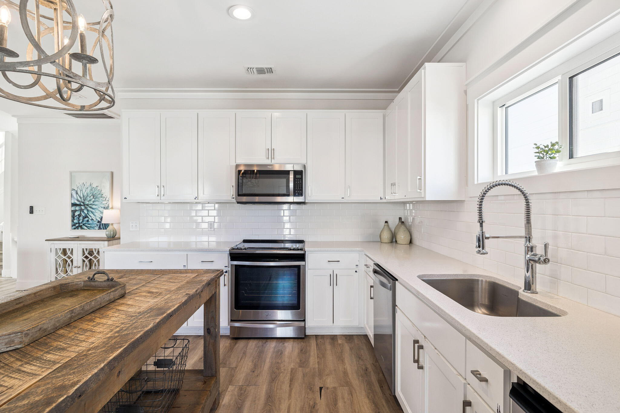 10 Blue Surf Lane Miramar Beach, FL 32550 - Photo 12 of 50 a kitchen with stainless steel appliances granite countertop a sink and stove top oven