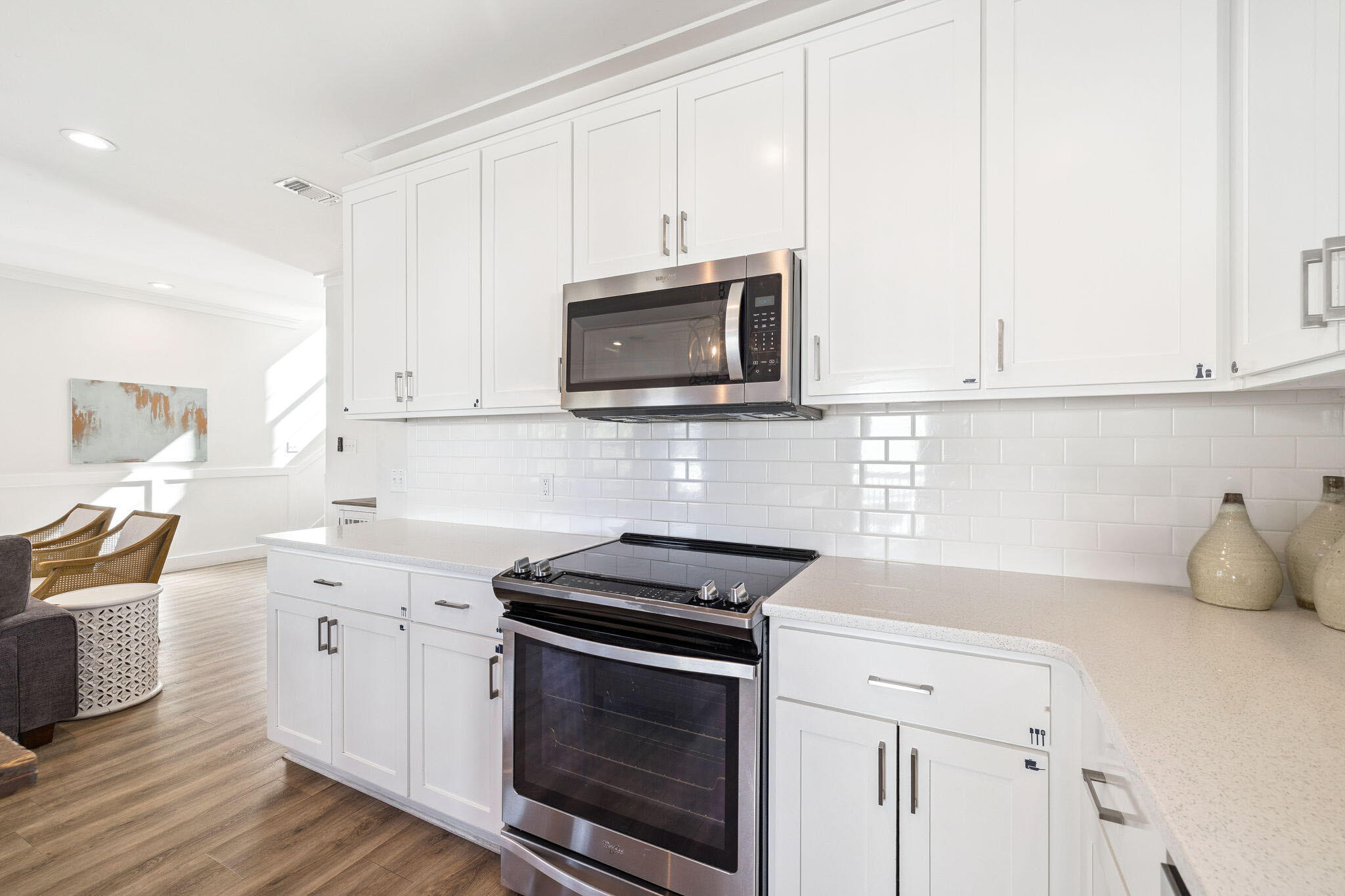 10 Blue Surf Lane Miramar Beach, FL 32550 - Photo 14 of 50 a kitchen with cabinets stainless steel appliances and wooden floor