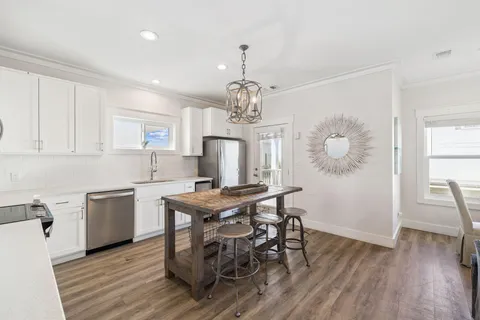 a backyard of a house with chairs