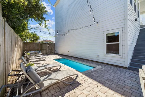 a view of a backyard with sitting area