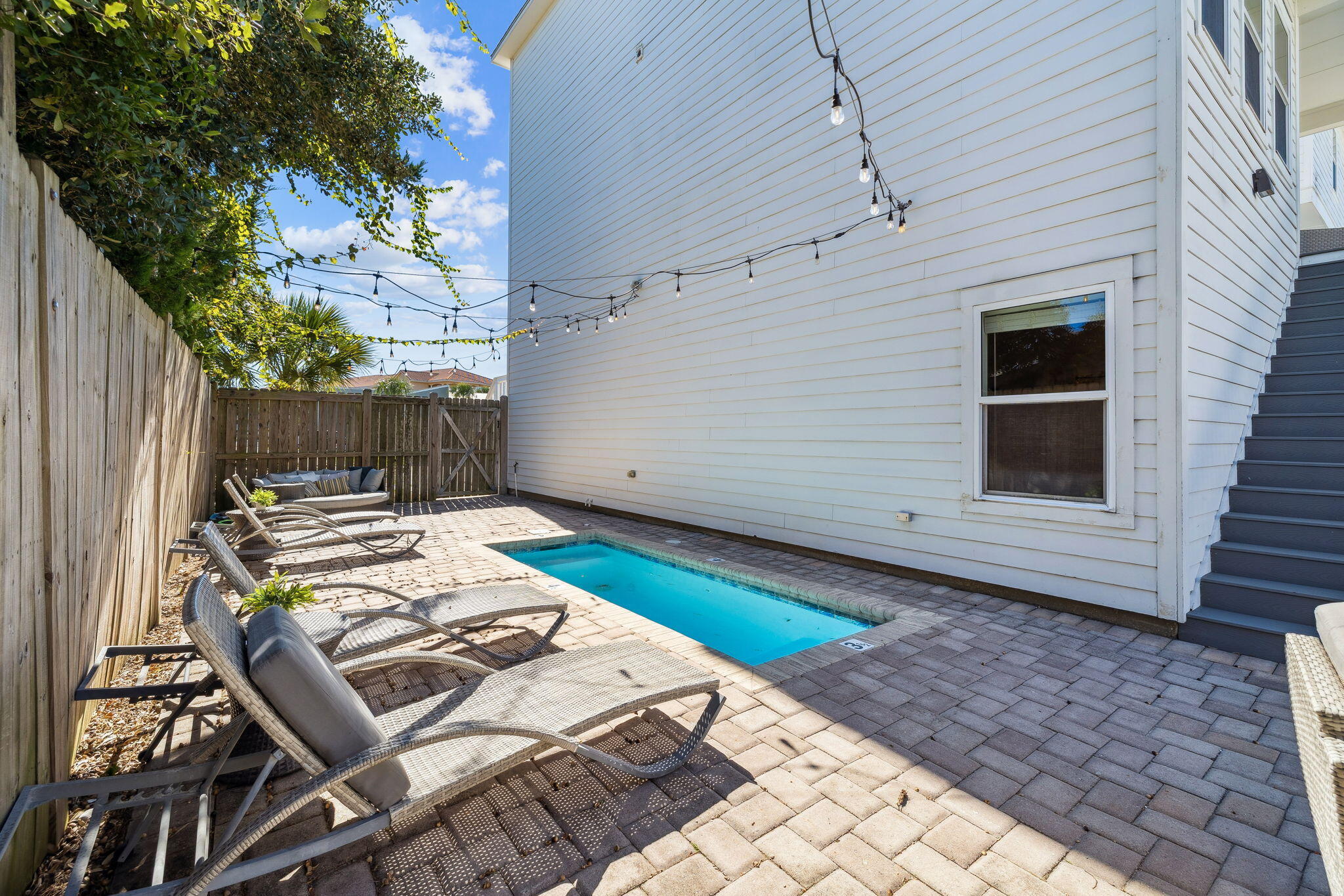 10 Blue Surf Lane Miramar Beach, FL 32550 - Photo 16 of 50 a backyard of a house with chairs