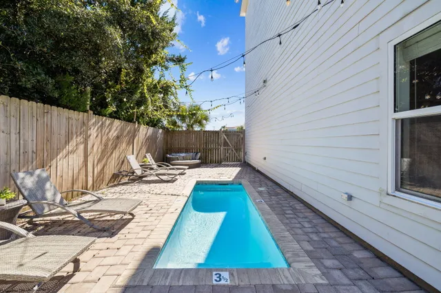 a view of a backyard with sitting area