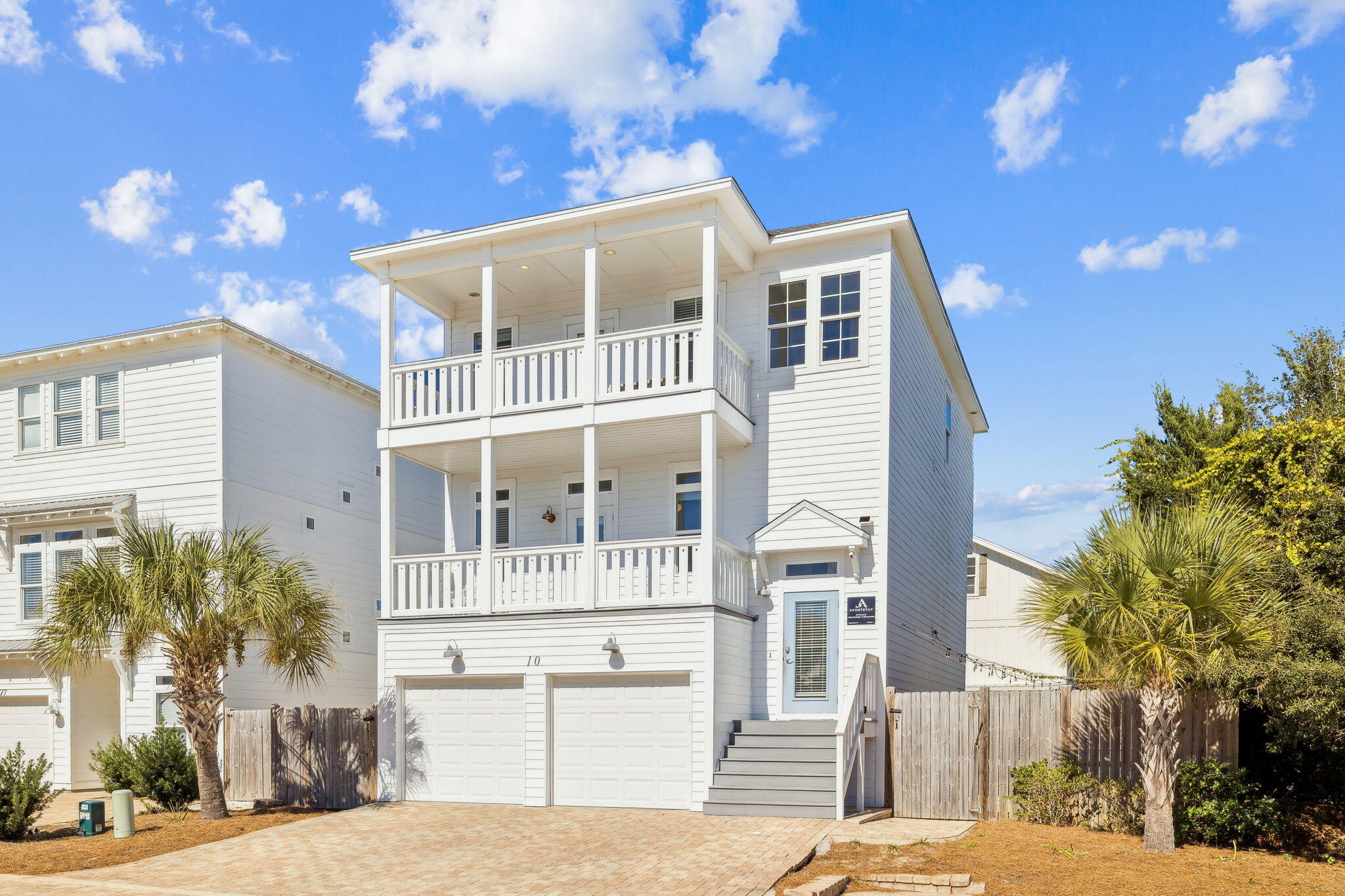 10 Blue Surf Lane Miramar Beach, FL 32550 - Photo 2 of 50 a front view of a building with a garden
