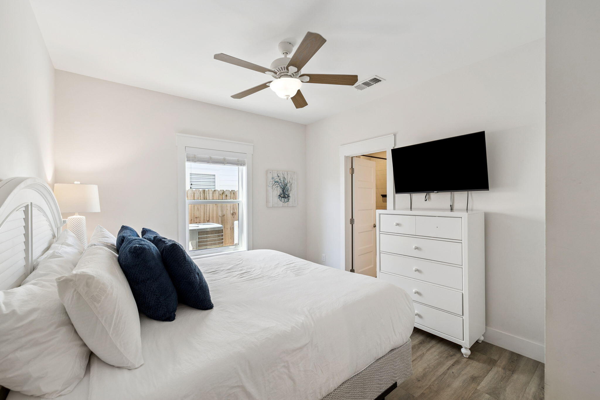 10 Blue Surf Lane Miramar Beach, FL 32550 - Photo 26 of 50 a bedroom with a large bed and a flat screen tv