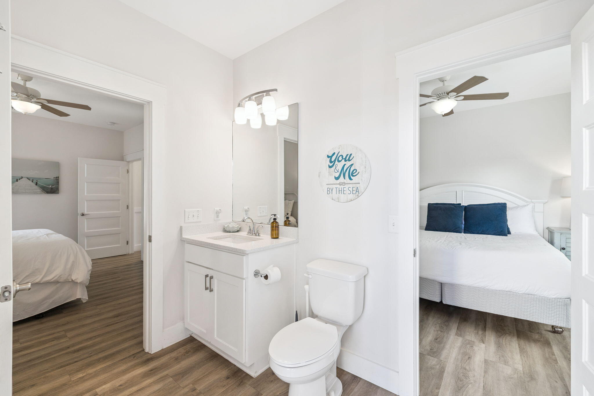 10 Blue Surf Lane Miramar Beach, FL 32550 - Photo 27 of 50 a bathroom with a toilet a sink and mirror