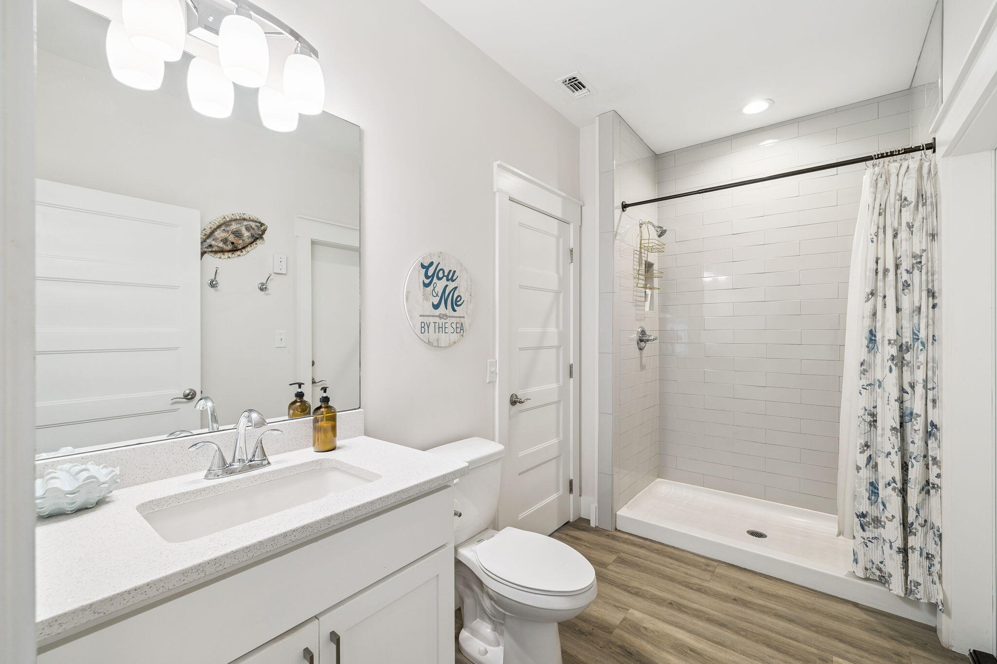 10 Blue Surf Lane Miramar Beach, FL 32550 - Photo 28 of 50 a bathroom with a sink a toilet and shower