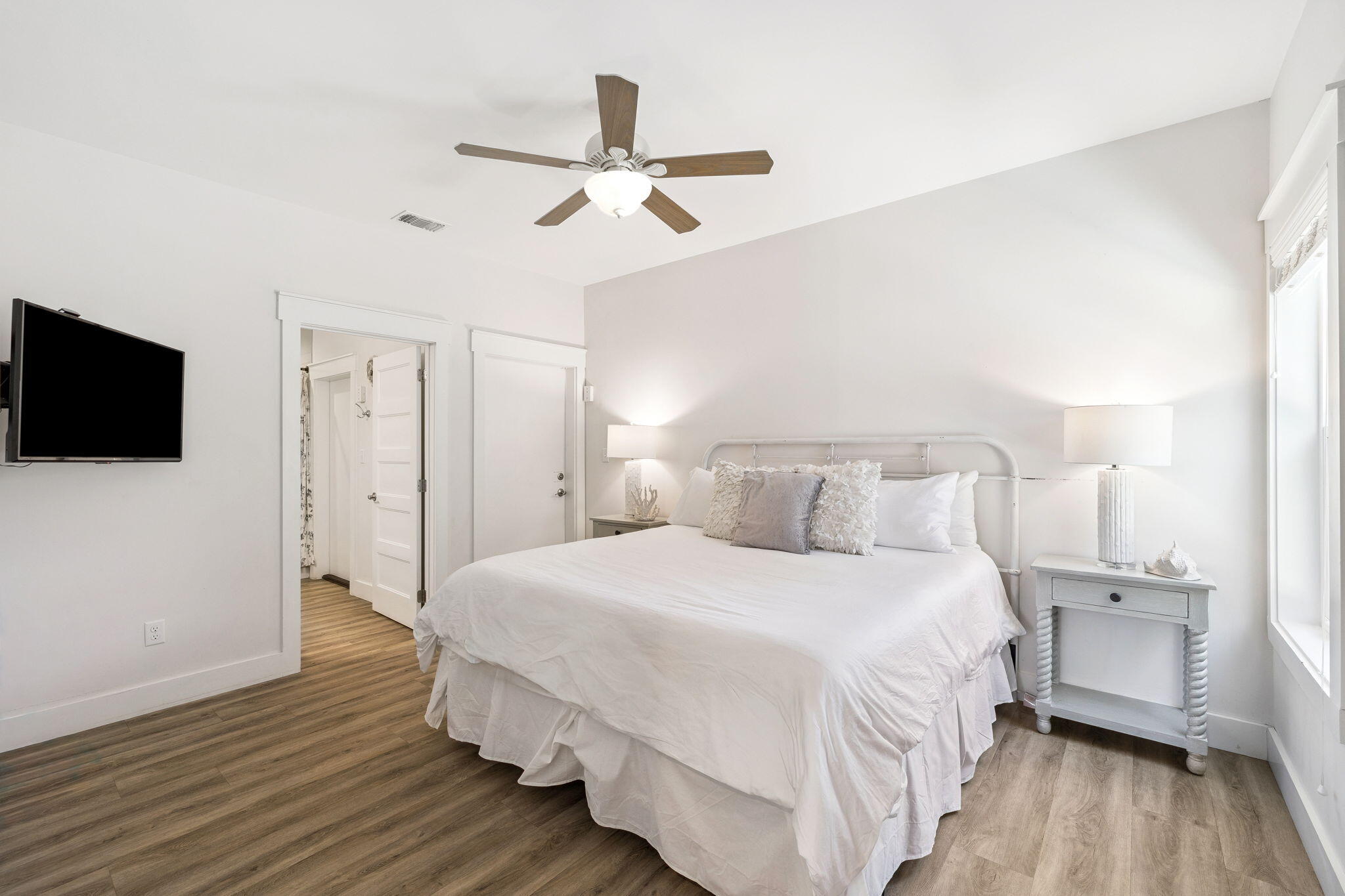 10 Blue Surf Lane Miramar Beach, FL 32550 - Photo 29 of 50 a bedroom with a bed and a flat tv screen on dresser