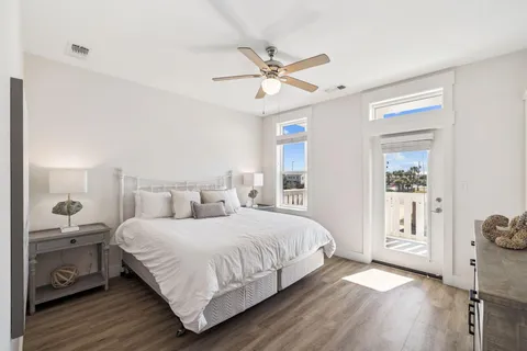 a bedroom with a flat screen tv and a bed