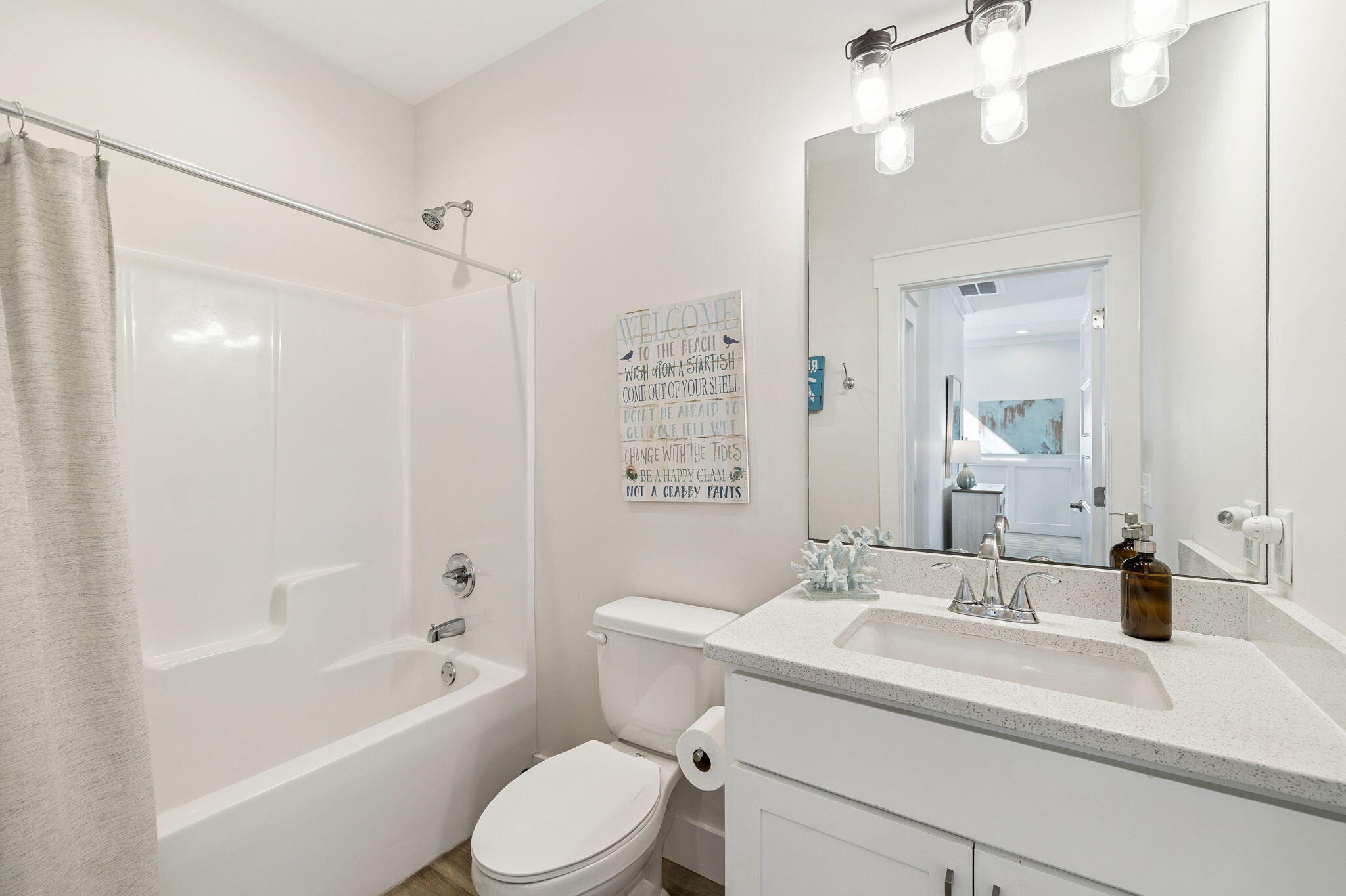 10 Blue Surf Lane Miramar Beach, FL 32550 - Photo 33 of 50 a bathroom with a sink a toilet and shower