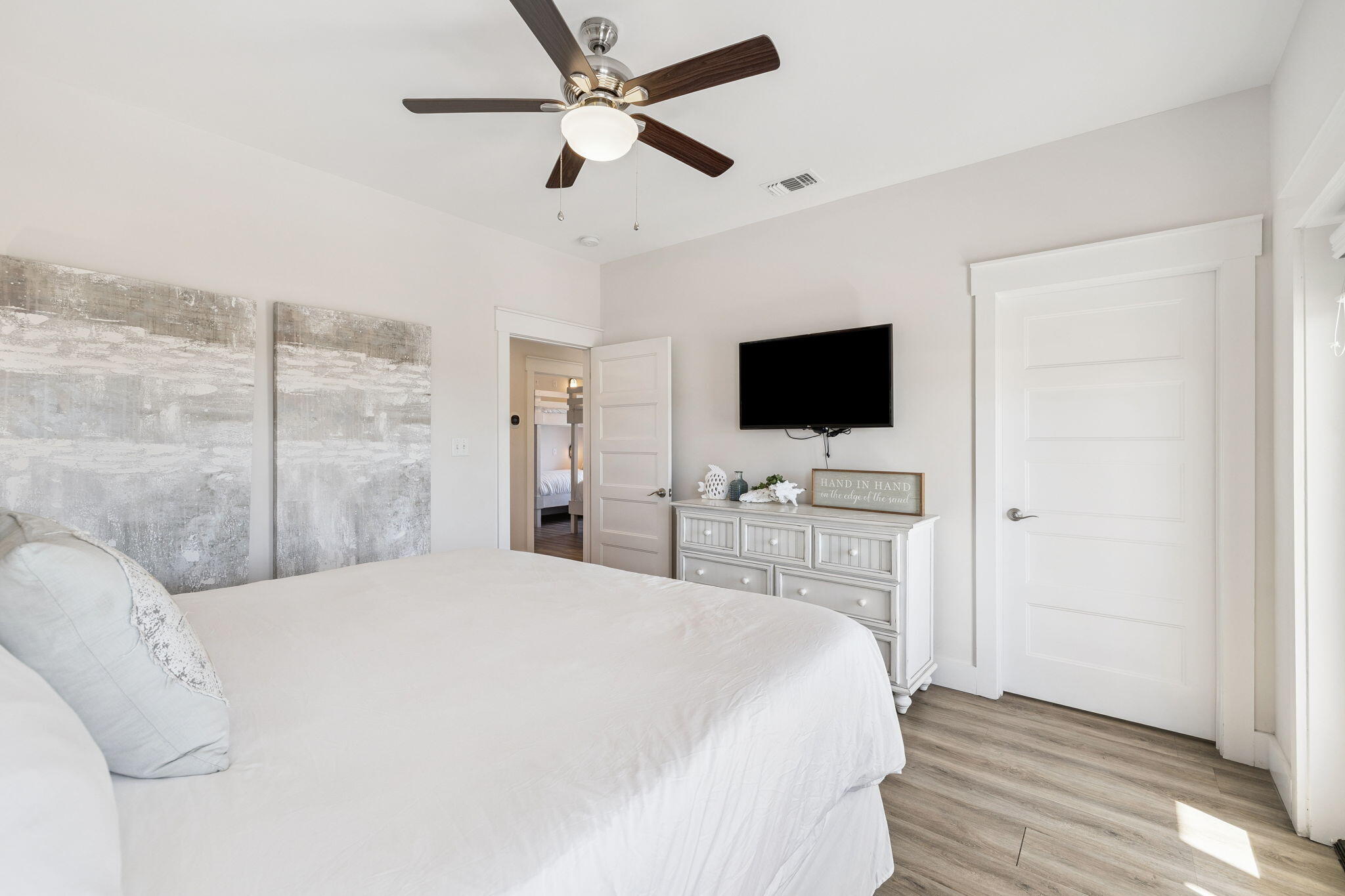 10 Blue Surf Lane Miramar Beach, FL 32550 - Photo 46 of 50 a bedroom with a bed and a flat tv screen on dresser