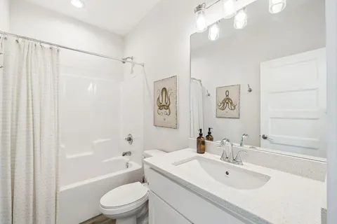 a view of a balcony with wooden floor
