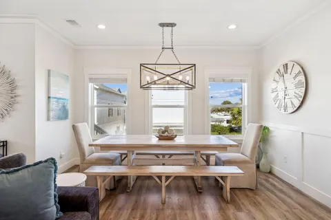 a workspace with furniture window and wooden floor