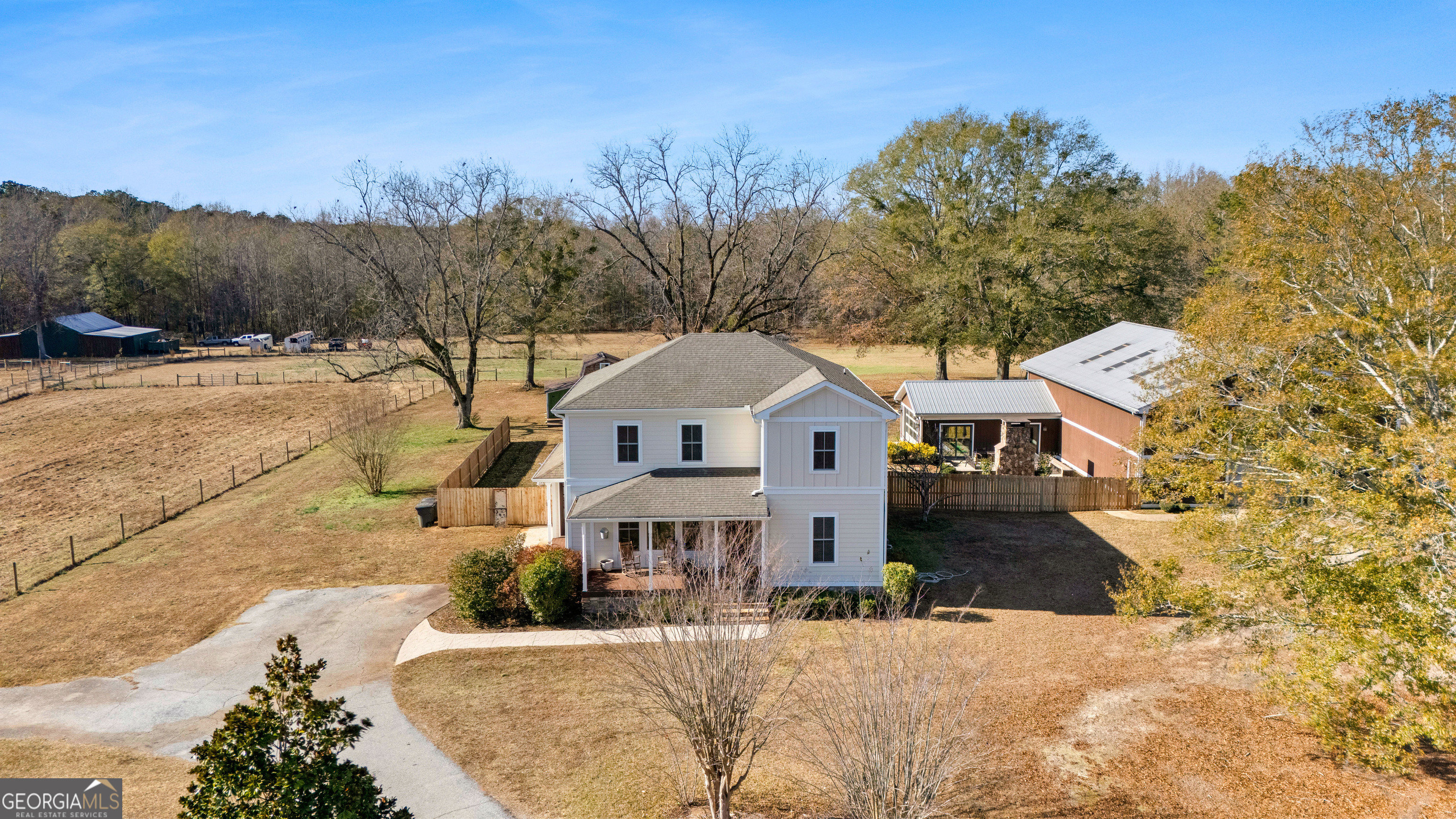 a view of a house with a yard covered in snow
