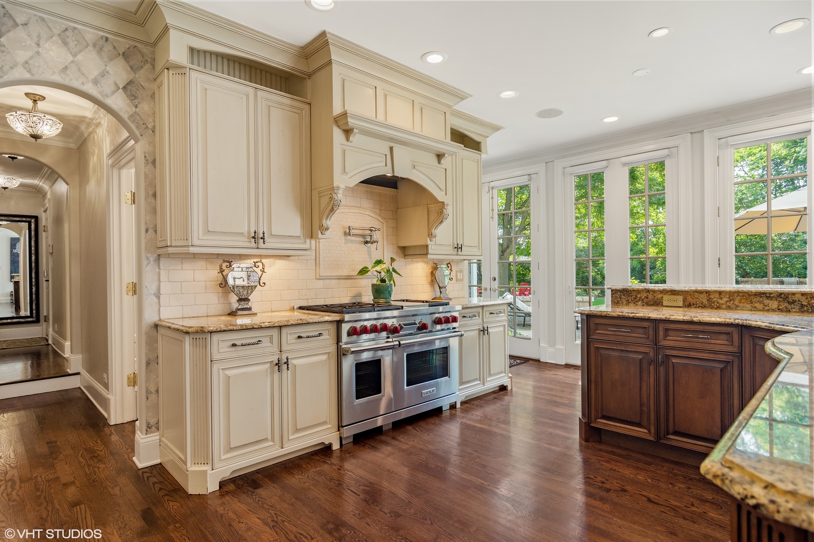 1717 Appleby Road Inverness, IL 60067 - Photo 12 of 57 a kitchen with stainless steel appliances granite countertop wooden floors and sink