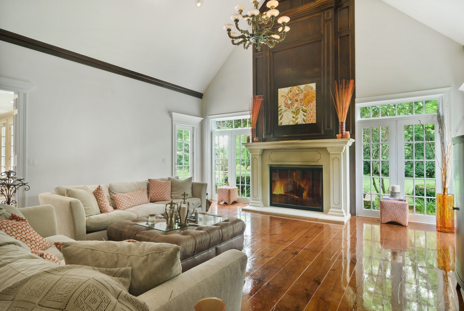 1717 Appleby Road Inverness, IL 60067 - Photo 21 of 57 a living room with furniture a chandelier and a fireplace