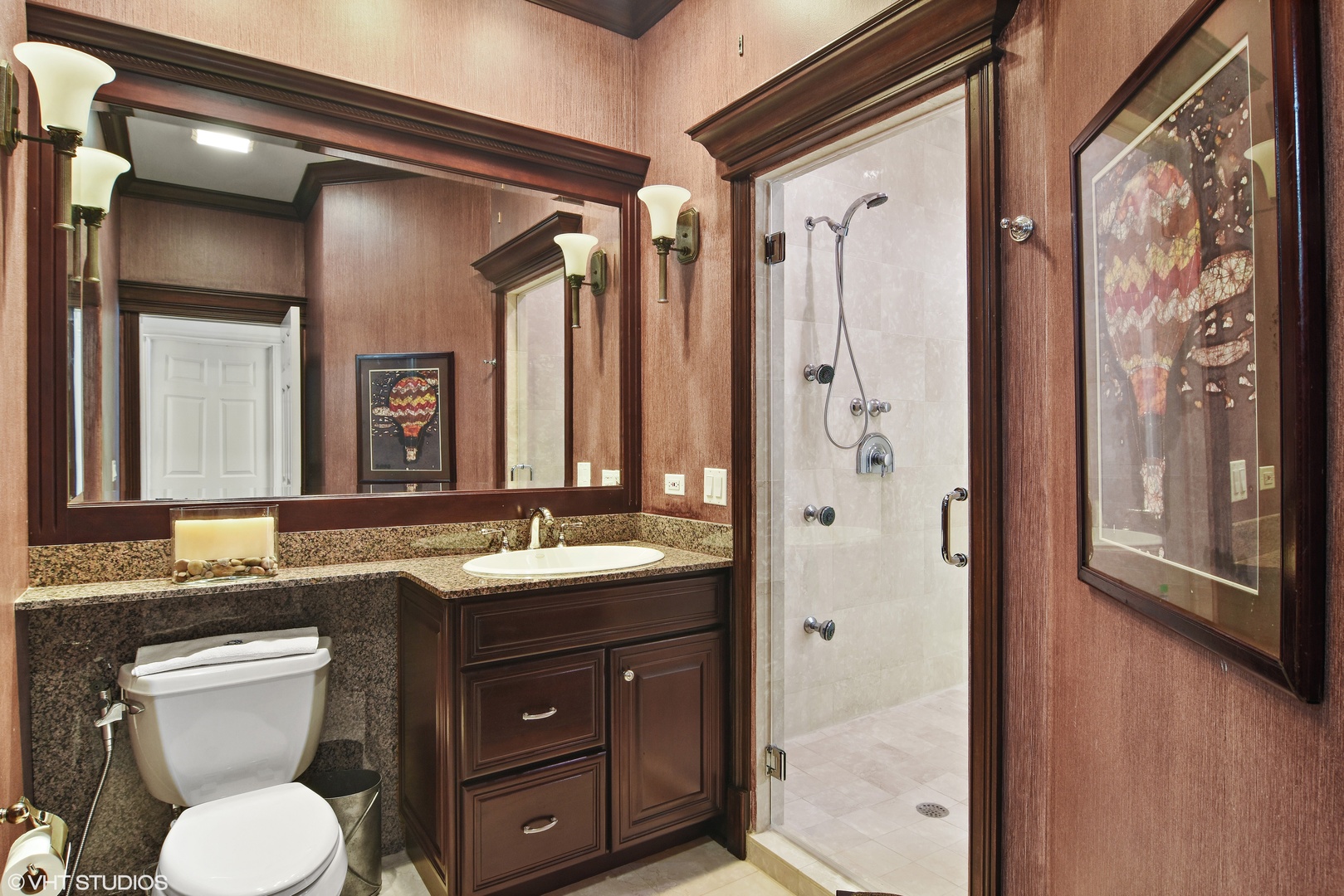 1717 Appleby Road Inverness, IL 60067 - Photo 29 of 57 a bathroom with a granite countertop sink toilet a mirror a vanity and shower