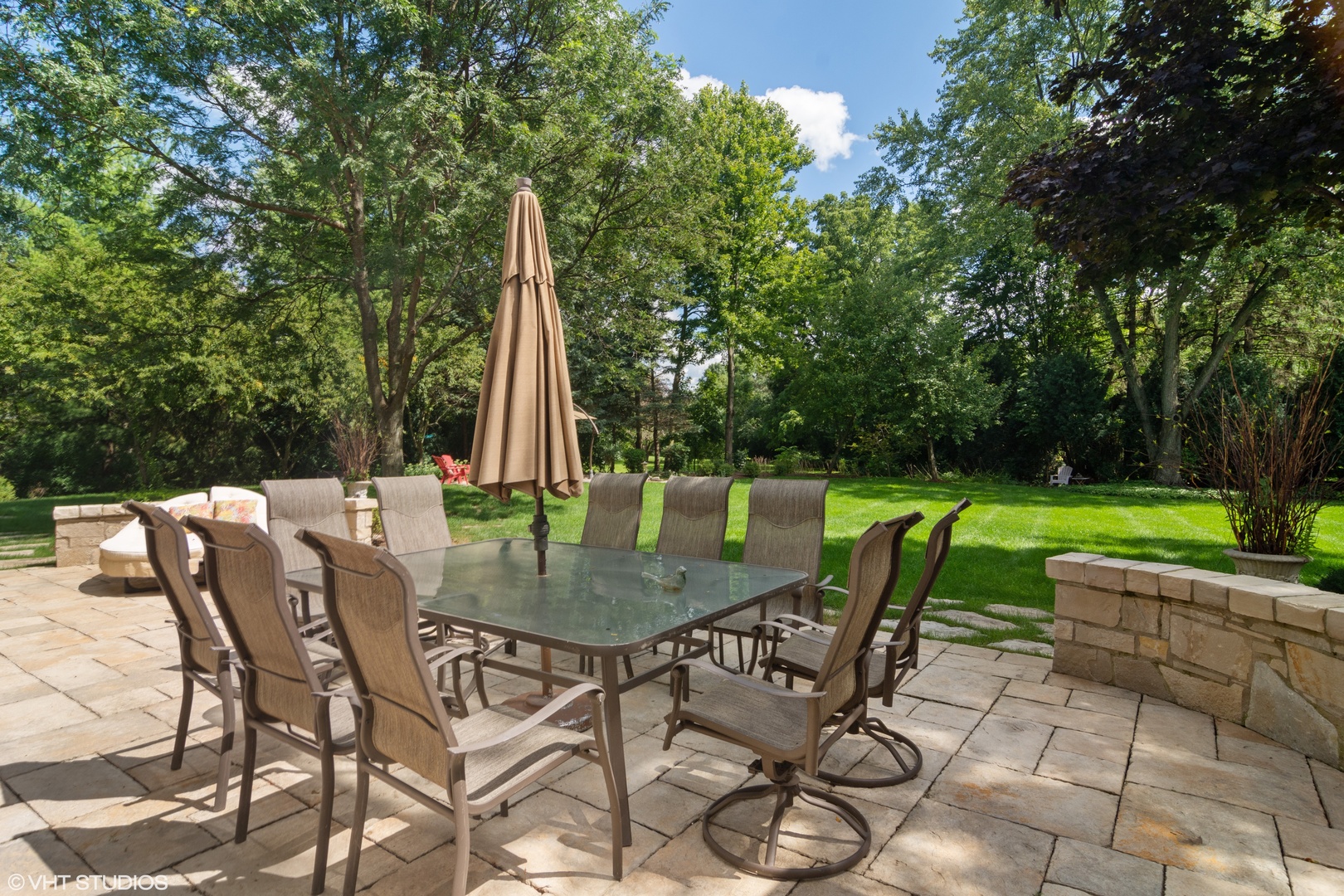 1717 Appleby Road Inverness, IL 60067 - Photo 46 of 57 a view of a patio with a table chairs and a backyard