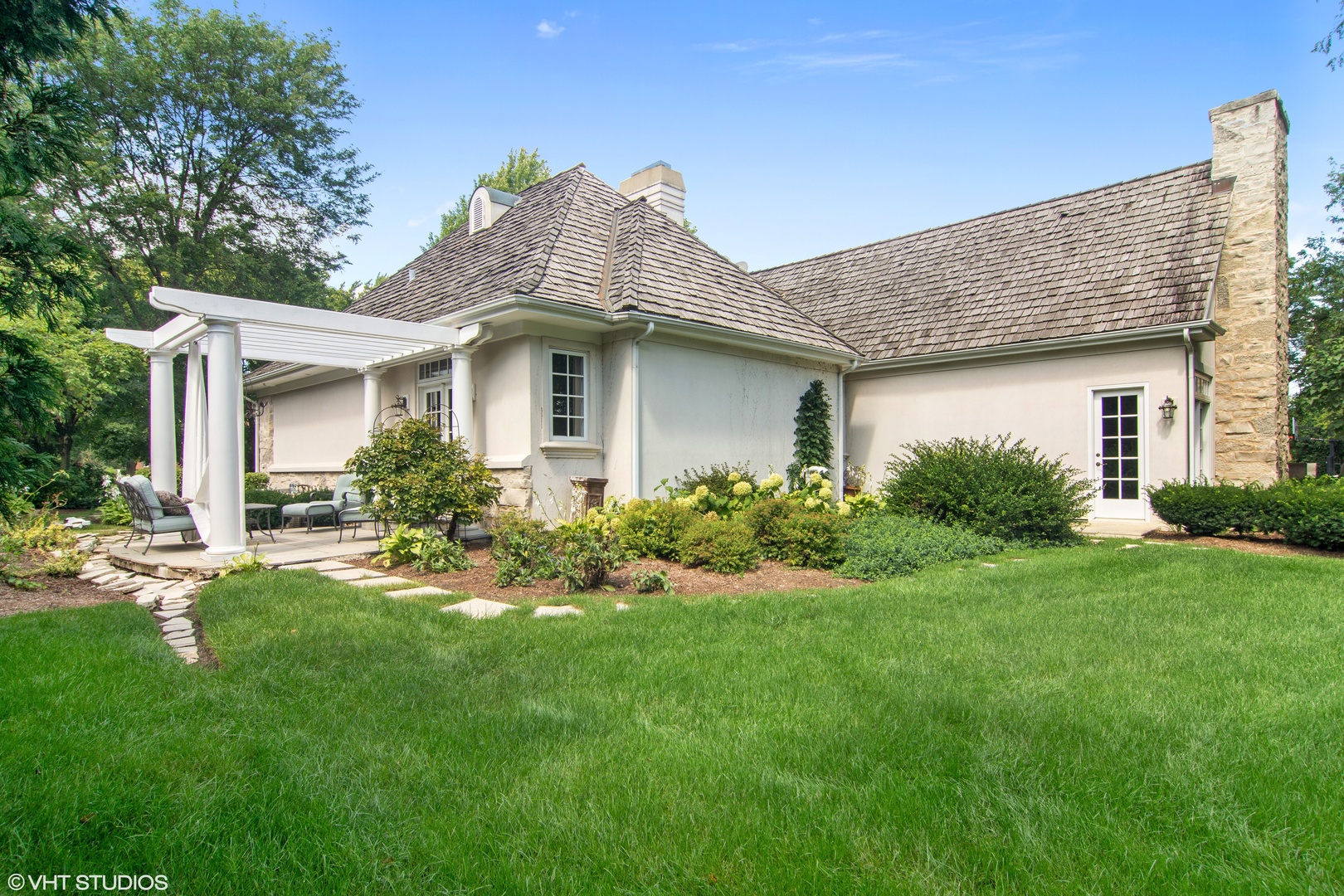 1717 Appleby Road Inverness, IL 60067 - Photo 48 of 57 a front view of a house with a garden