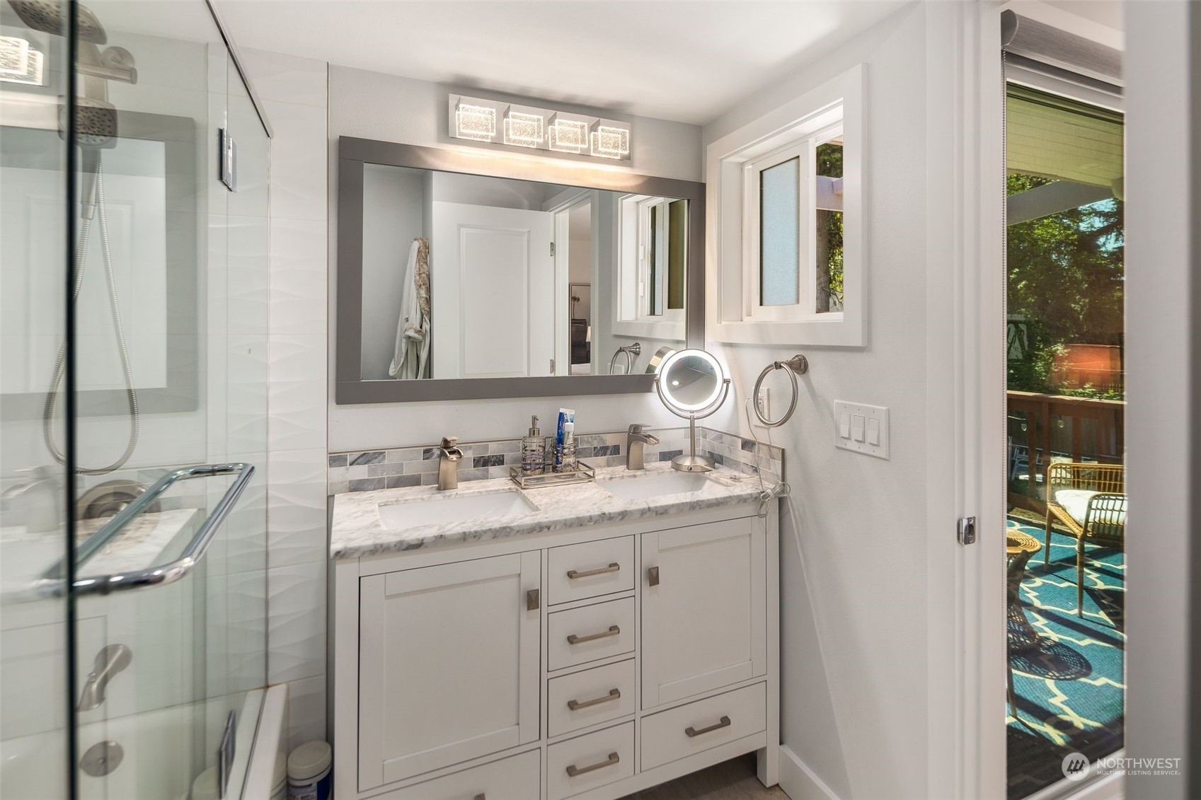 102 Bellflower Road Bothell, WA 98012 - Photo 12 of 40 a bathroom with a granite countertop sink and a mirror