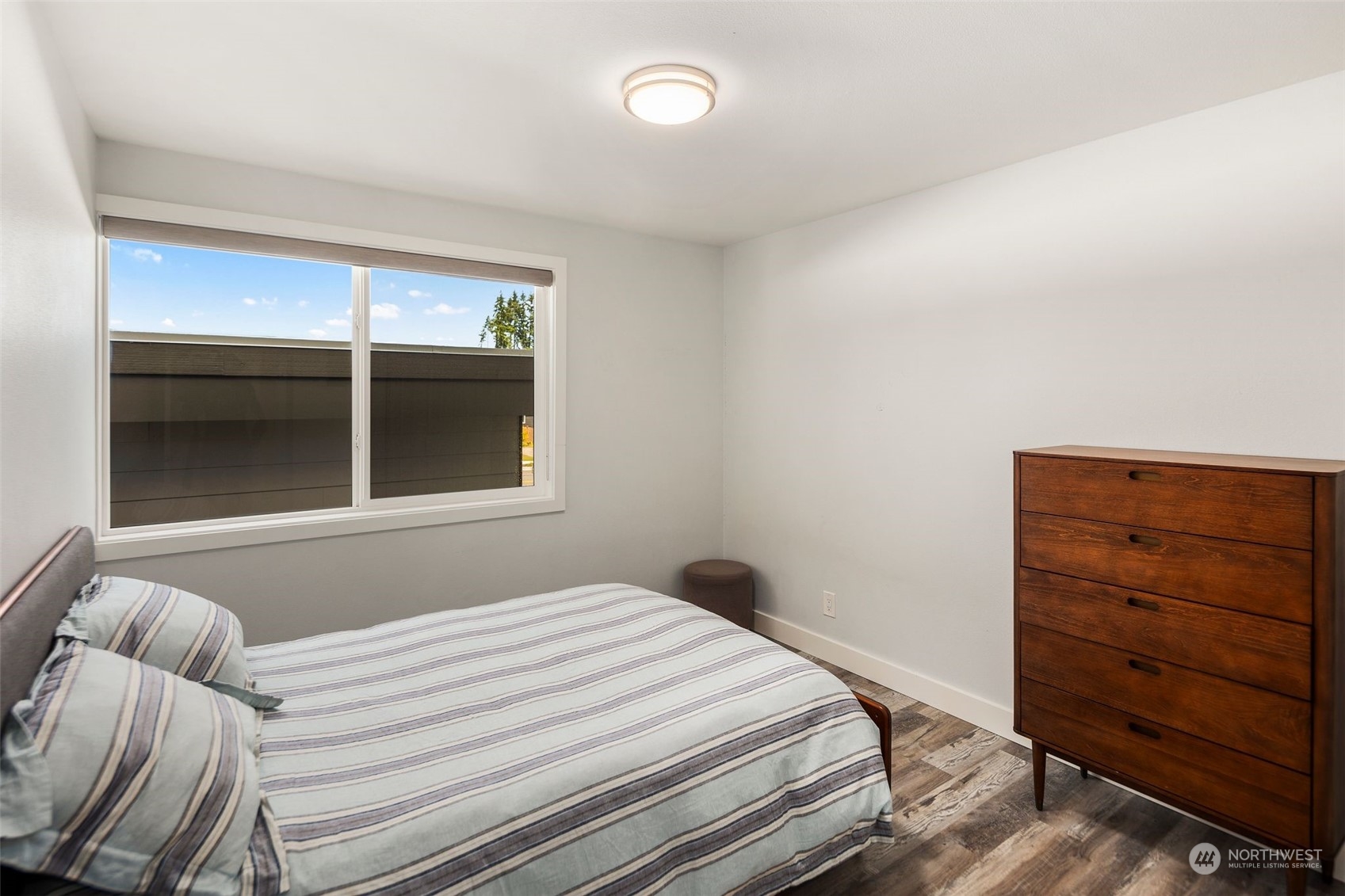 102 Bellflower Road Bothell, WA 98012 - Photo 15 of 40 a bedroom with a bed and a dresser